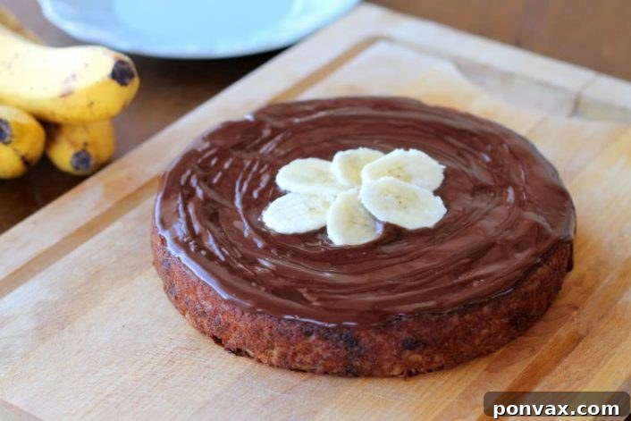 Paleo Banana Bliss Cake with Chocolate Ganache 6 Freshly mashed ripe bananas, a key ingredient for the Paleo Banana Cake, demonstrating the simplicity of the recipe. A naturally sweet and healthy component for this gluten-free dessert.