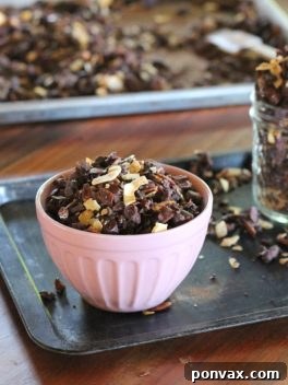Finished Chocolate Coconut Paleo Granola in a jar, ready for storage or serving.