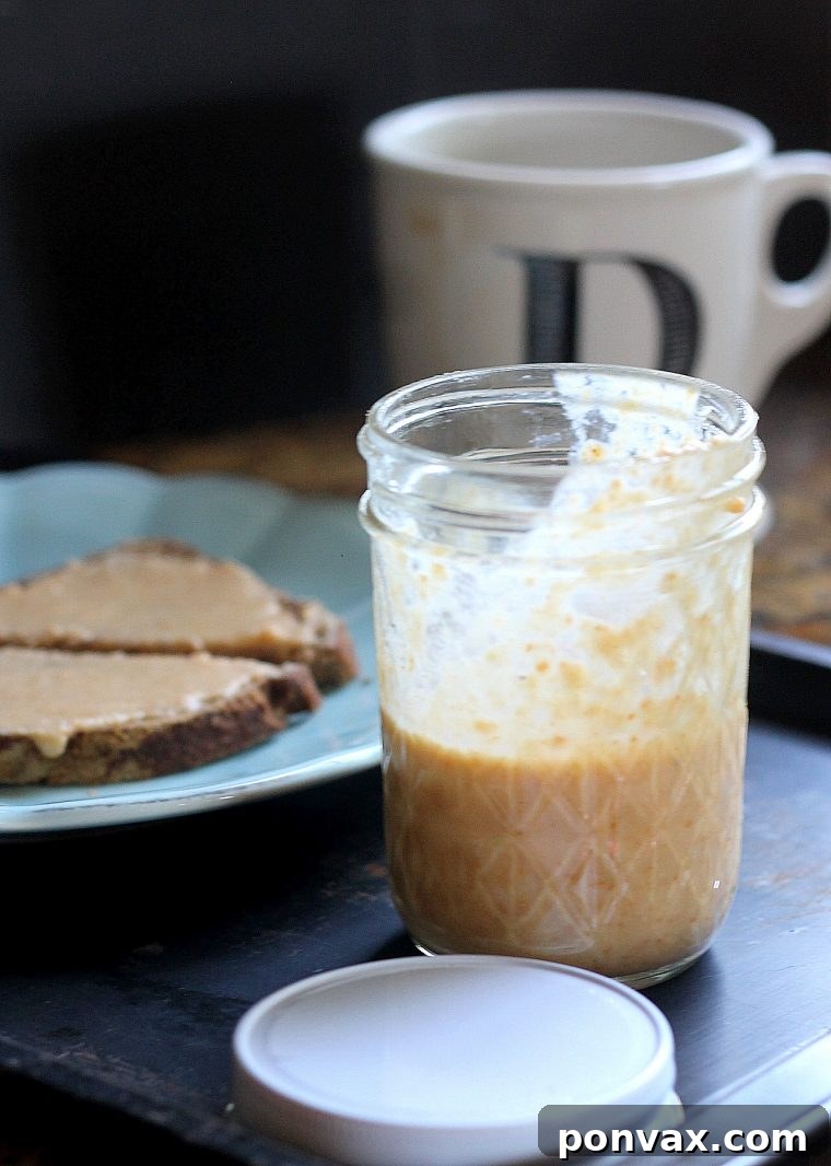 Caramelized Coconut Butter 2 Creamy homemade toasted coconut butter in a jar, perfect for spreading.