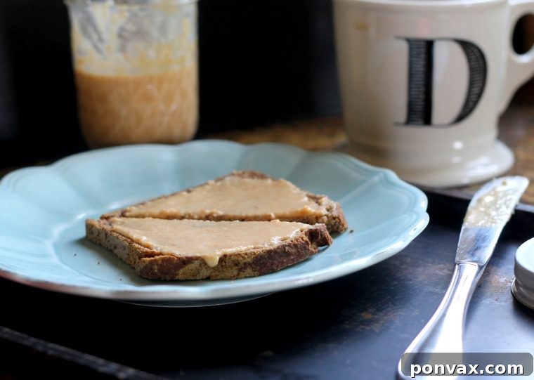 Caramelized Coconut Butter 3 Close-up of smooth, creamy toasted coconut butter in a bowl.