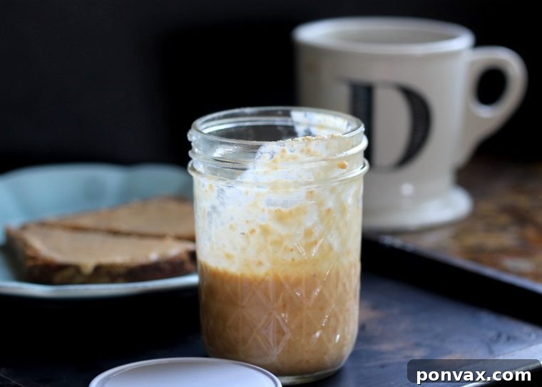 Caramelized Coconut Butter 5 Close-up of toasted coconut butter in a wooden bowl.