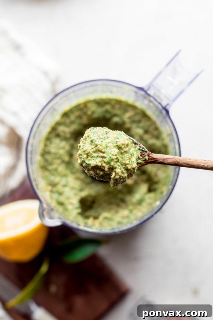 Freshly blended fennel frond pesto in a food processor