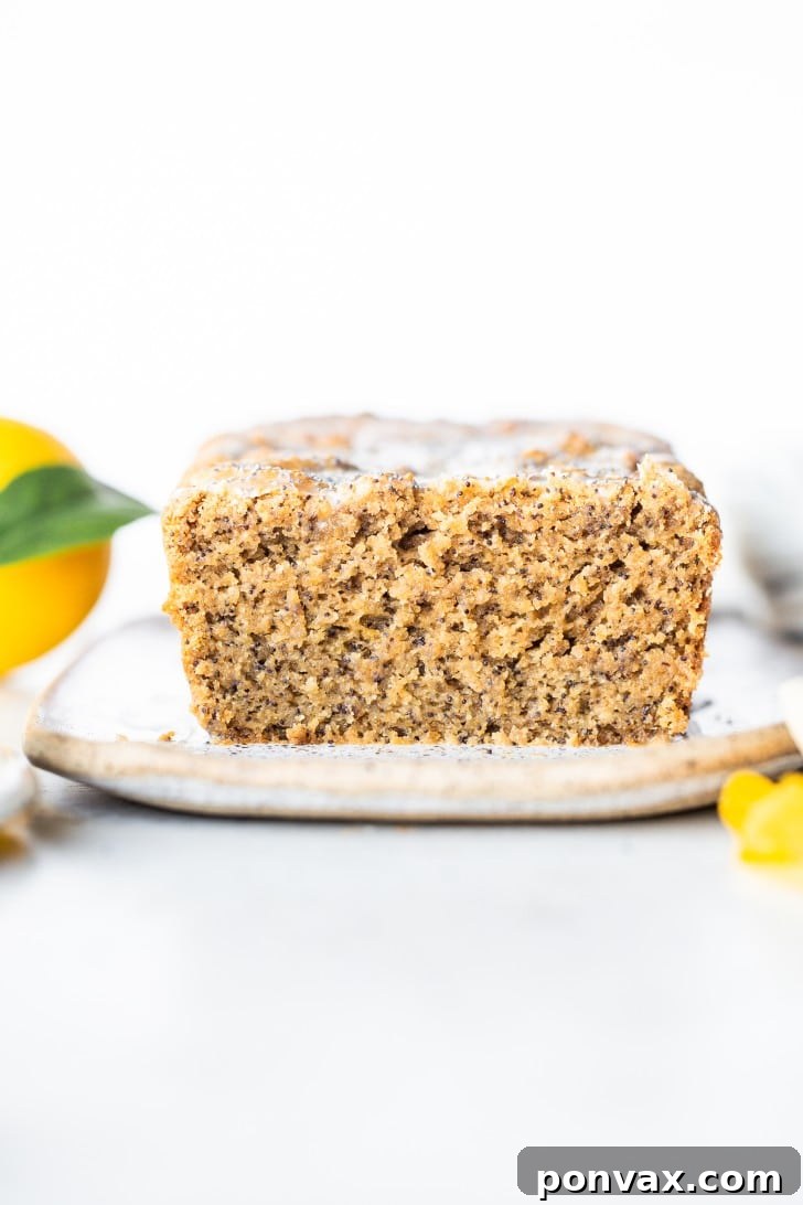 Zesty Gluten-Free Lemon Poppyseed Loaf 5 Overhead shot of Gluten-Free Lemon Poppyseed Loaf Cake with glaze and poppy seeds.