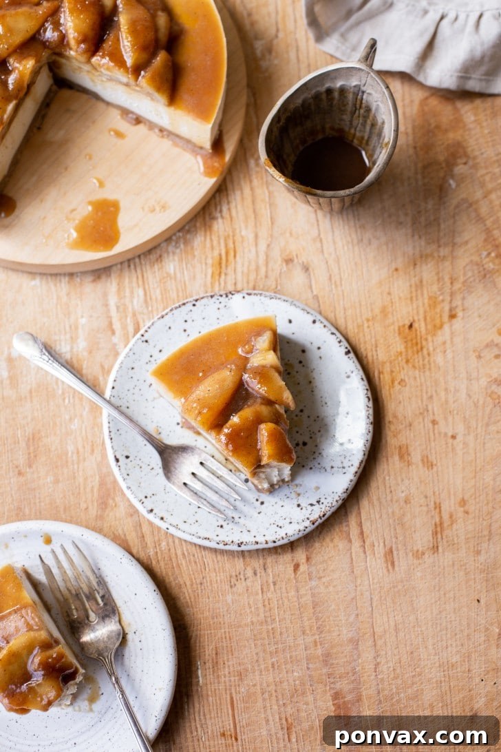 A close-up of a single slice of Vegan Pear Cheesecake with a fork, ready to be enjoyed.