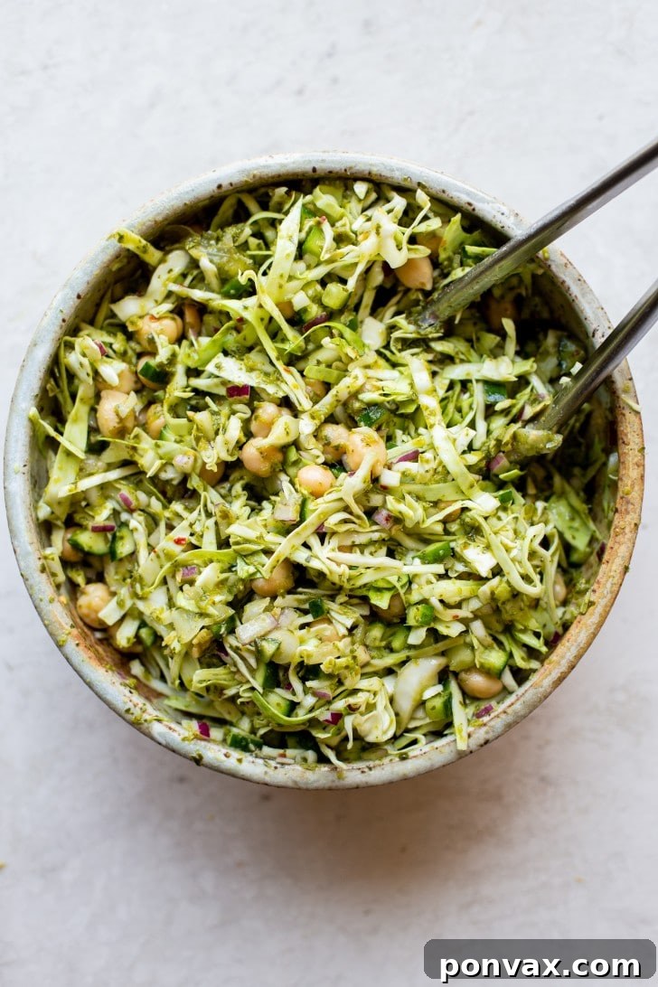 Vibrant Five Ingredient Chimichurri Chickpea Salad 4 Close-up photo of the Chickpea Chimichurri Salad, with a focus on the vivid green chimichurri coating the chickpeas and diced vegetables.