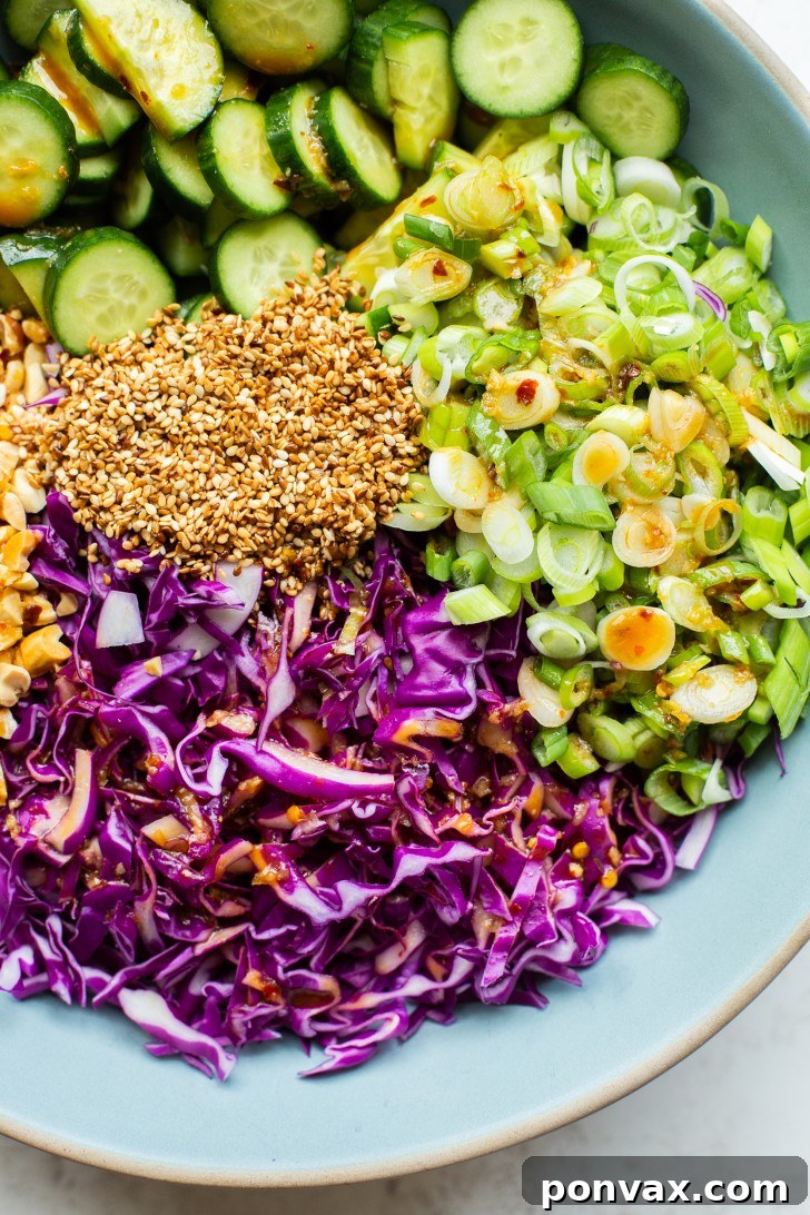 Ingredients for the Miso Sesame Dressing laid out, including tamari, rice vinegar, lime, miso, and chili crisp.