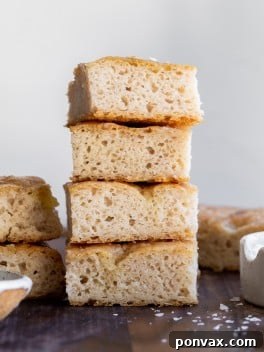 Effortless Gluten-Free Focaccia 17 Close-up of baked gluten-free focaccia bread with toppings.
