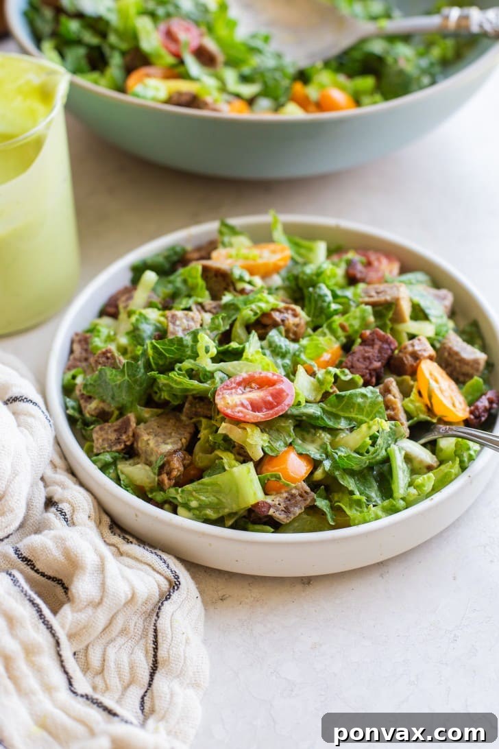 Plant-Based BLT Salad with Creamy Avocado Ranch 5 A bowl of Vegan BLT Salad generously coated with the creamy avocado ranch dressing, ready to be served.