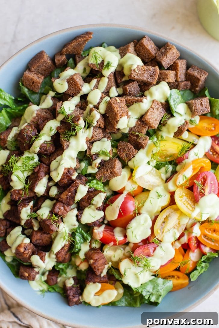 Plant-Based BLT Salad with Creamy Avocado Ranch 6 Ingredients for Vegan BLT Salad arranged separately for meal prep: tempeh bacon, dressing, toasted bread, and fresh vegetables.