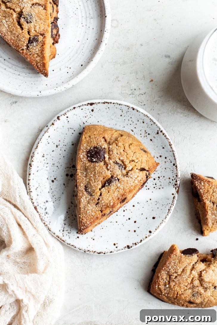 Stacked sweet Chocolate Chip Gluten-Free Sourdough Discard Scones, showcasing their golden-brown exterior and generous chocolate chunks, perfect for a dairy-free and vegan breakfast.