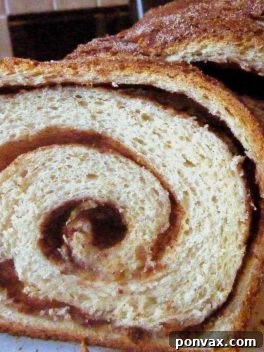 Cozy Cinnamon Swirl Bake 2 Cinnamon Swirl Bread loaf, sliced to show the perfect swirl pattern.