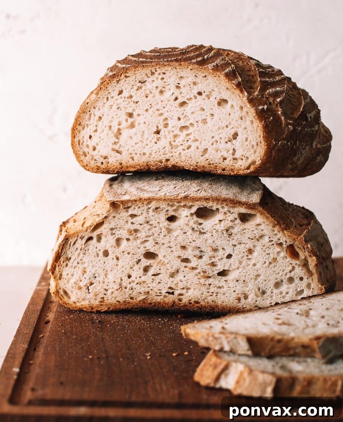 Psyllium Husk The Gluten-Free Binder Demystified 2 A freshly baked gluten-free sourdough bread, perfectly risen with a golden crust, highlighting the success psyllium husk brings to gluten-free baking.