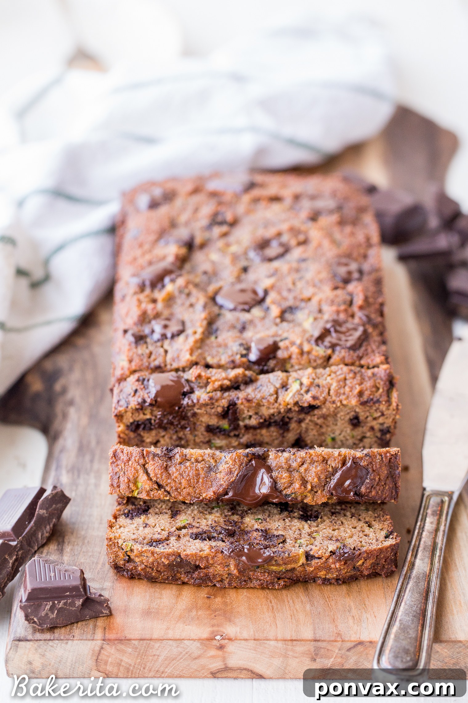 Paleo Zucchini Chocolate Chunk Delight 7 Stack of Chocolate Chunk Zucchini Bread slices on a plate