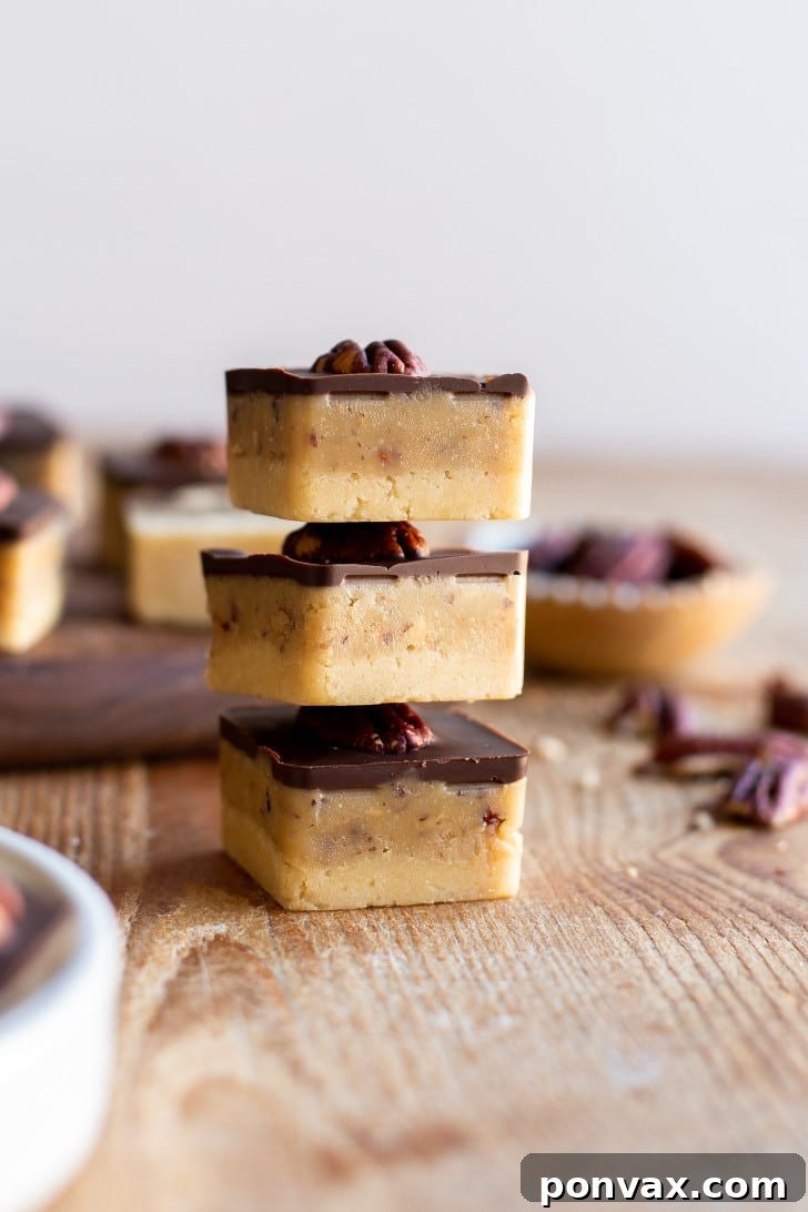 Close-up of a tray of No-Bake Vegan Turtle Bites ready for chilling, showing the caramel layer.