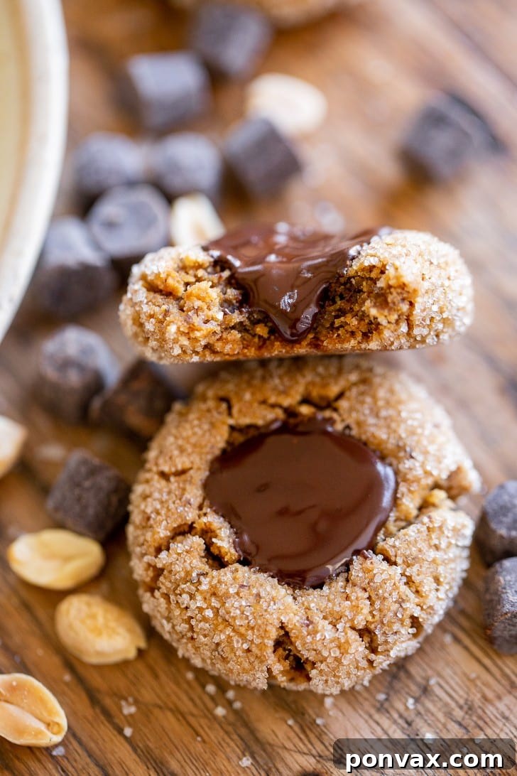 Close-up of baked vegan peanut butter blossoms with chocolate centers