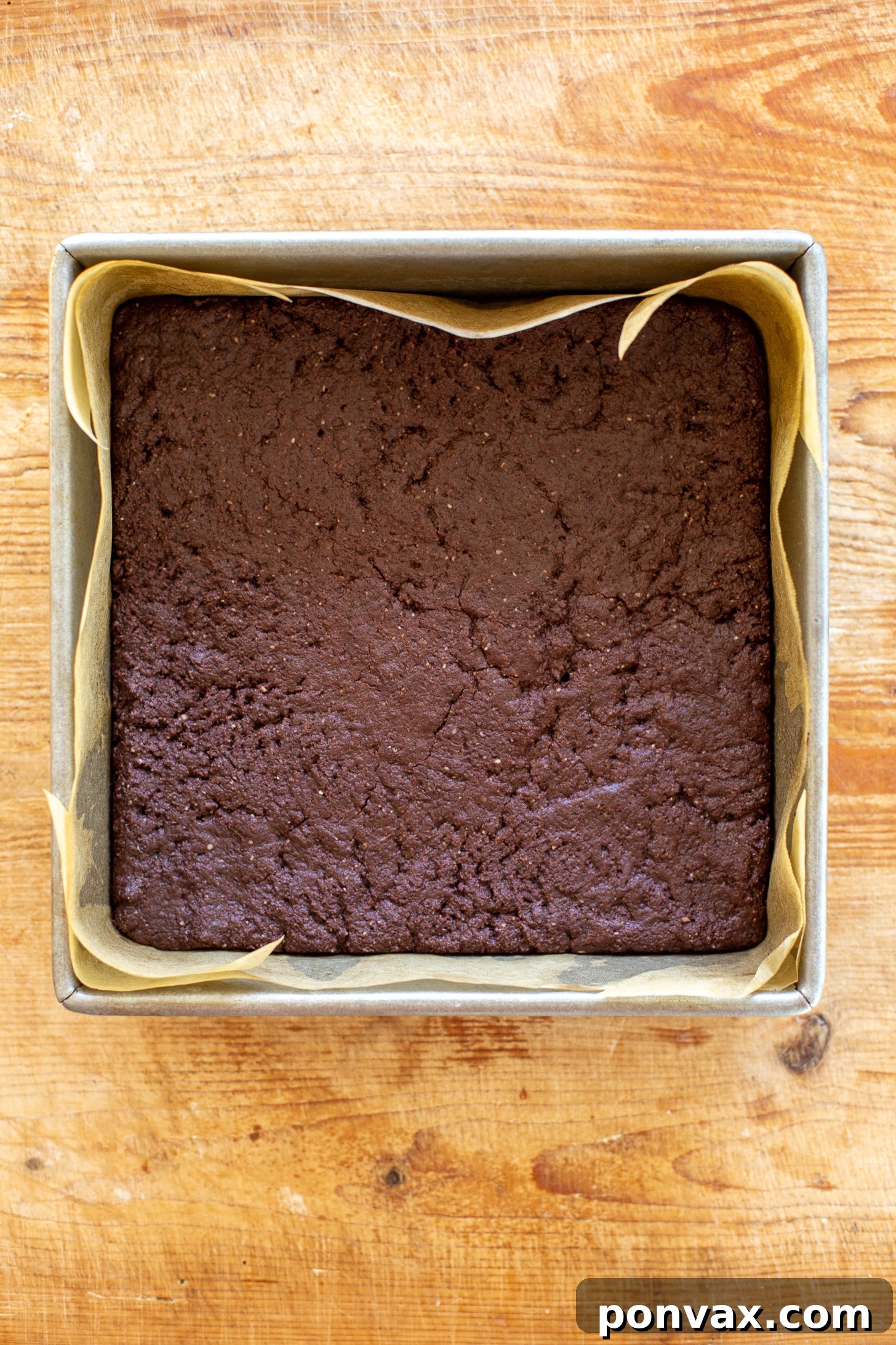 Decadent Gluten-Free Coconut Caramel Brownies 4 Ingredients for gluten-free vegan brownies being mixed in a bowl.