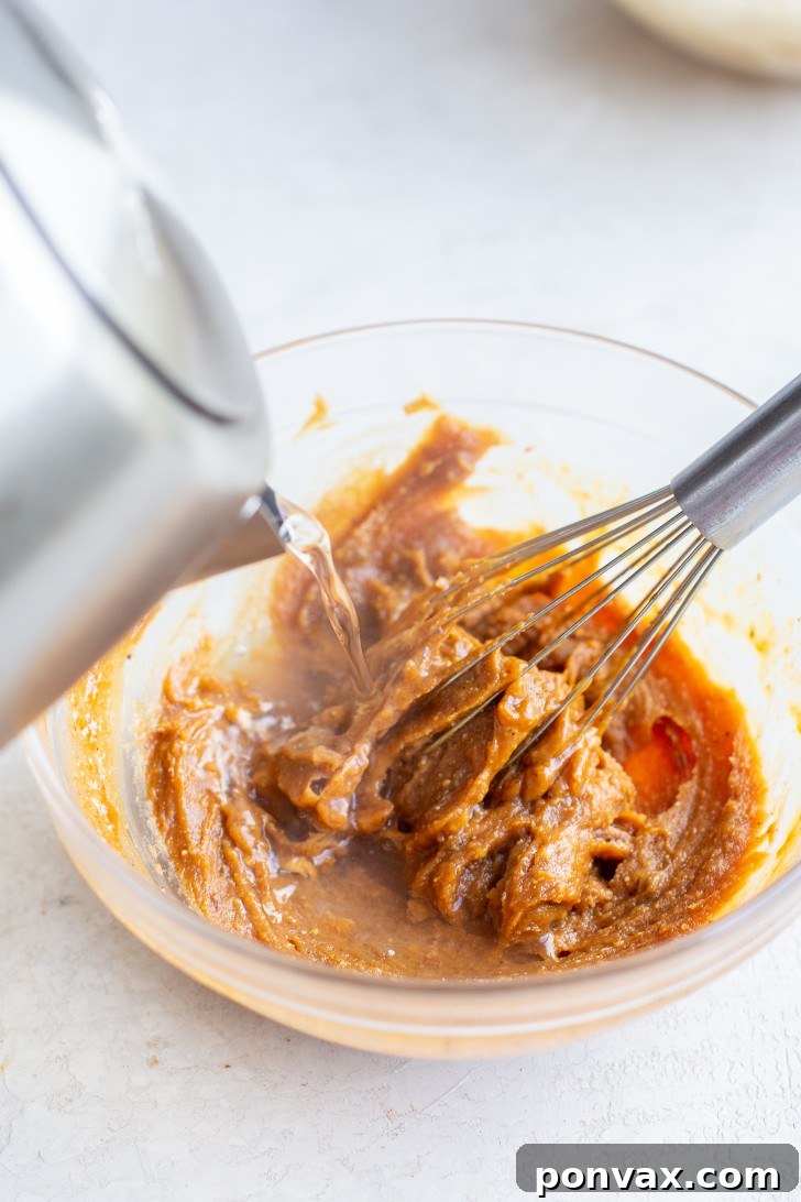 Velvety Peanut Noodles in 5 Minutes 9 Whisking the peanut sauce ingredients in a bowl.