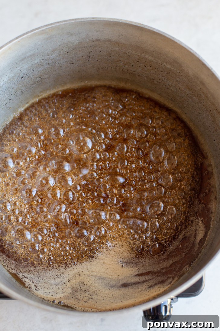 Maple syrup simmering in a pot