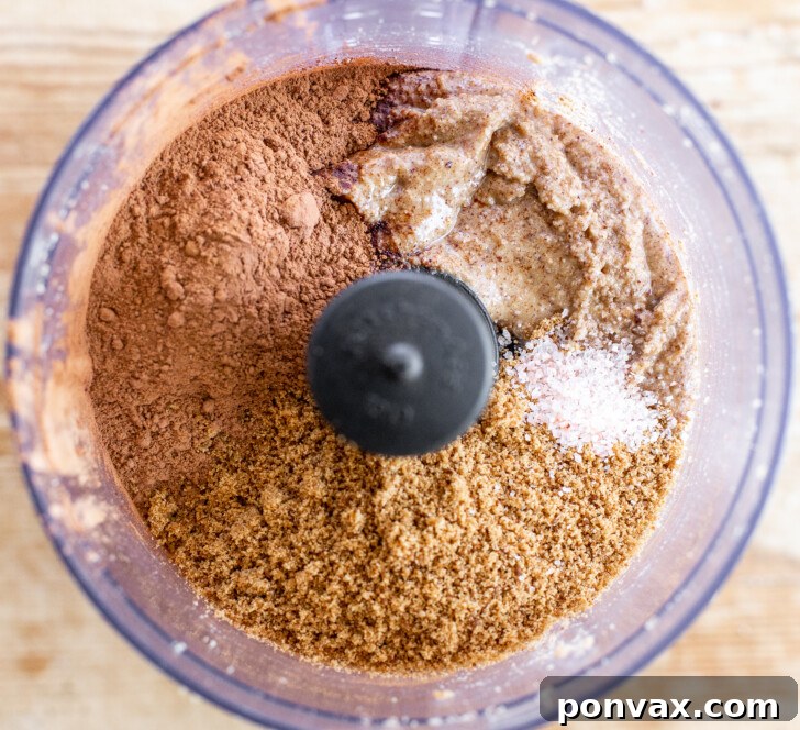 Adding cocoa powder and sugar to hazelnut butter