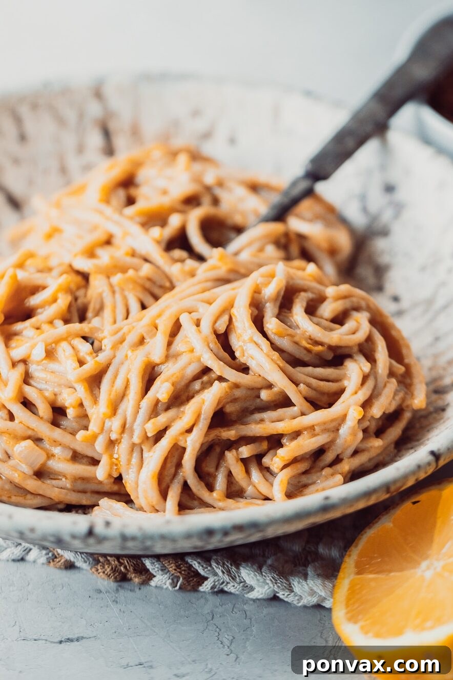 15+ Zesty Vegan Lemon Recipes 3 A vibrant display of fresh, whole lemons and sliced lemons, showcasing their bright yellow color and juicy pulp, essential for healthy vegan lemon recipes.