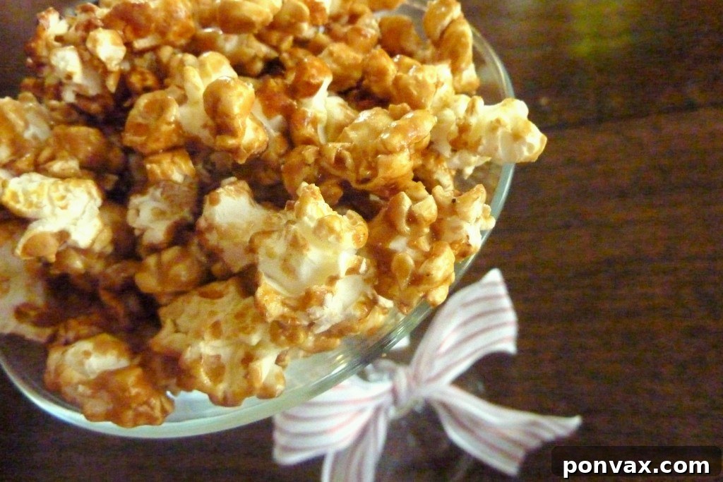 Delicious gluten-free and vegan caramel corn spread on a baking sheet, ready to be enjoyed.