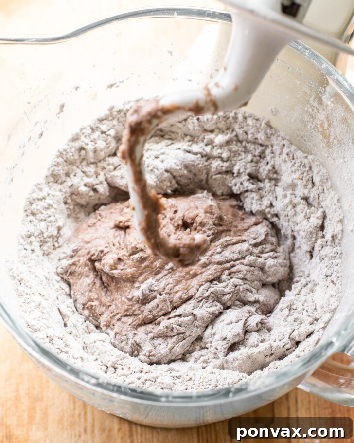 Step 5: Shaped dough resting in a floured banneton basket, ready for its first rise.