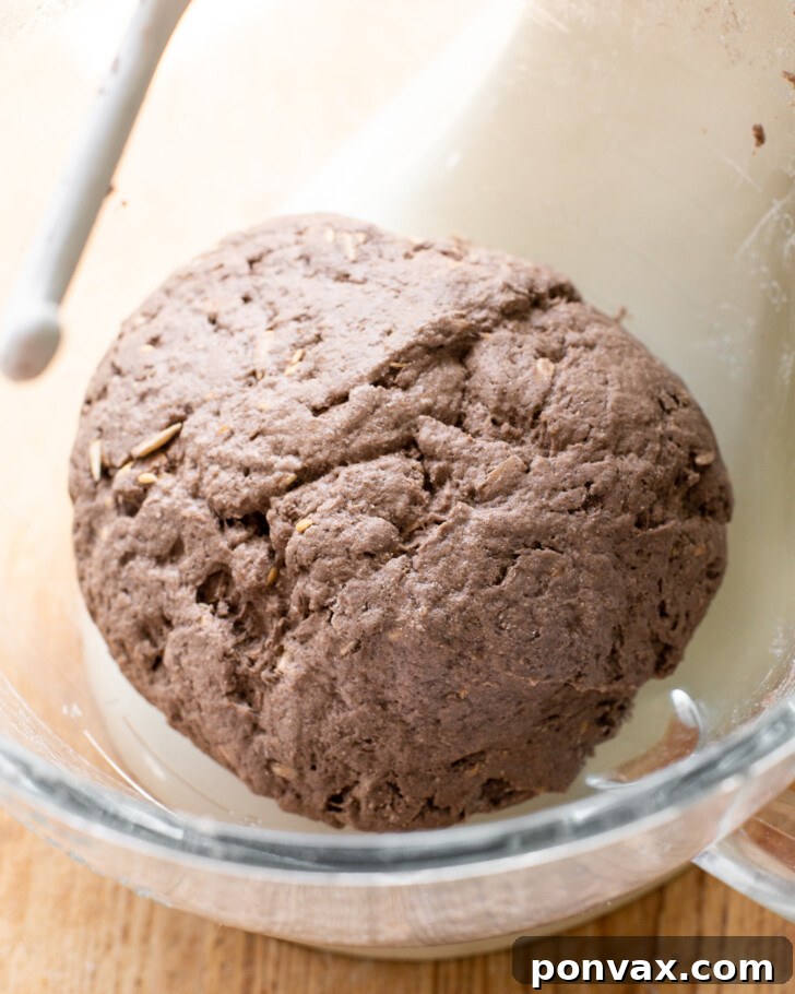Step 6: Loaf after rising, appearing puffy and light in the banneton.