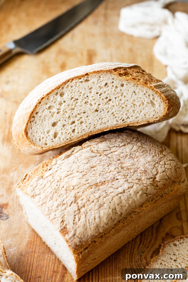 A freshly baked gluten-free yogurt bread loaf, cooling on a rack, with a golden brown crust and a delightful aroma filling the kitchen.