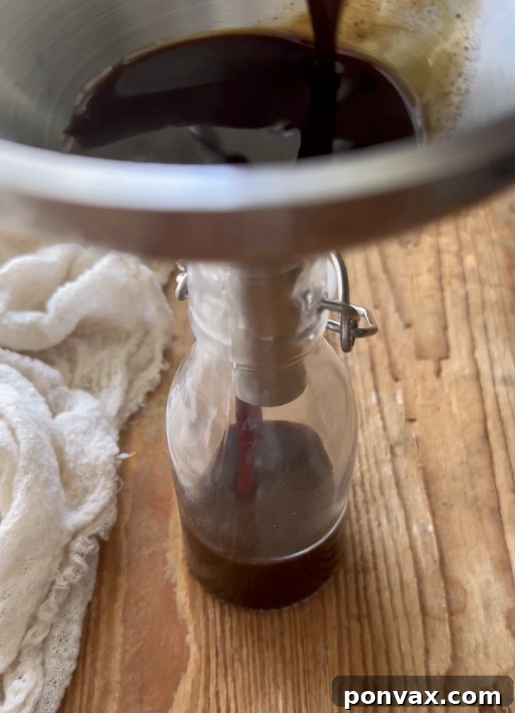 Handcrafted Gingerbread Elixir 8 A sealed jar of homemade gingerbread syrup on a wooden surface, ready for the holidays.