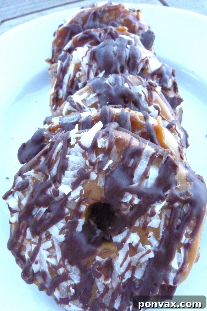 Homemade Samoas: Your Favorite Girl Scout Cookie Done in Your Kitchen Homemade Samoas (Caramel Delites) cookies perfectly arranged on a serving platter, showcasing their chocolate drizzle, toasted coconut, and caramel layers.