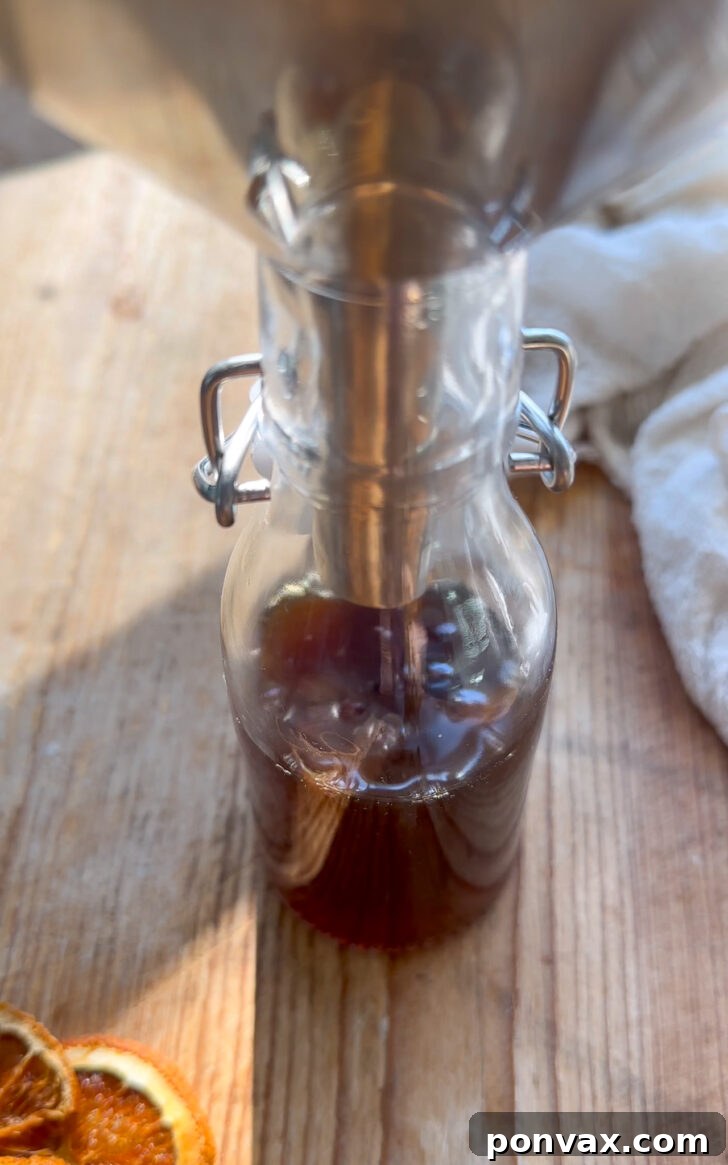 Seasonal Spice Infusion 9 Freshly strained winter spice syrup in a jar