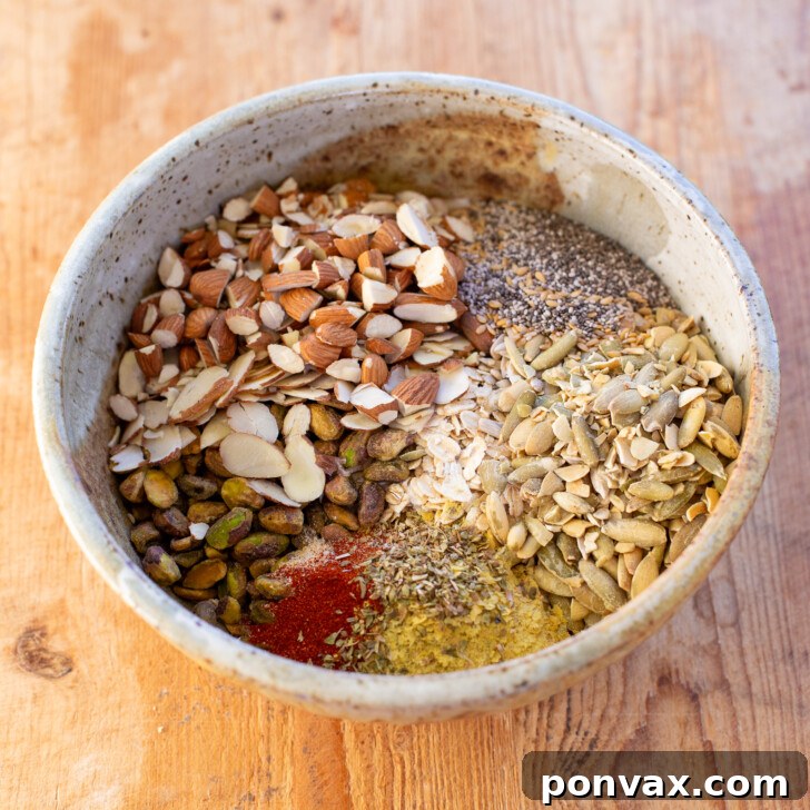 Dry ingredients for savory granola mixed in a bowl.