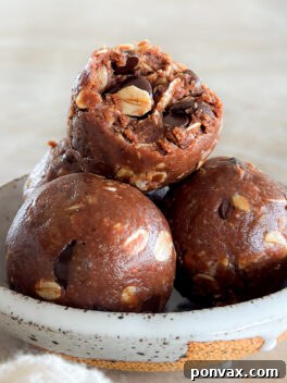 A close-up of a delectable chocolate oatmeal bite, showcasing its rich texture and inviting appearance, ready to be enjoyed as a healthy snack.