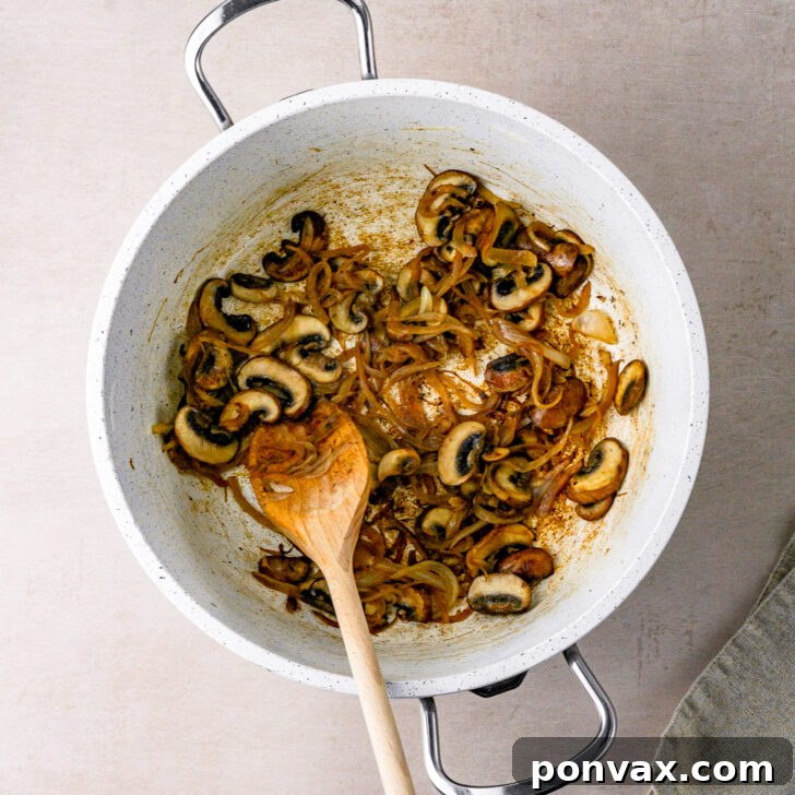 Wholesome One-Pot White Bean Mushroom Stew 6 Mushroom and onion mixture in a pot, nicely browned and fragrant.
