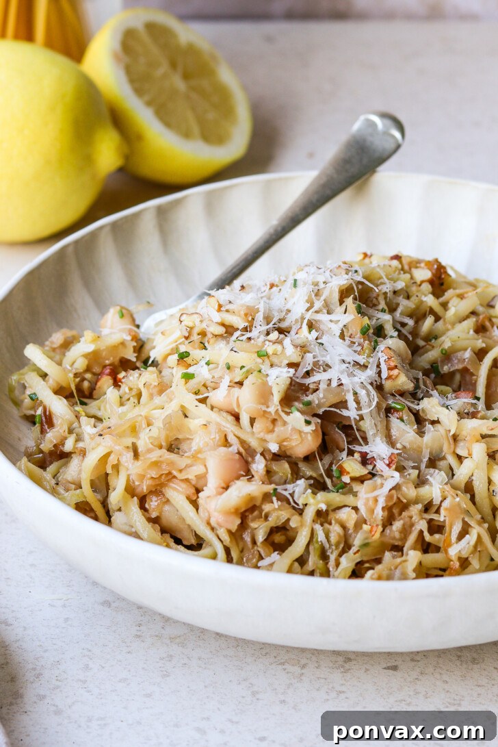 A vibrant, close-up image of the Caramelized Cabbage Pasta in a serving bowl, showcasing its warmth and inviting texture.