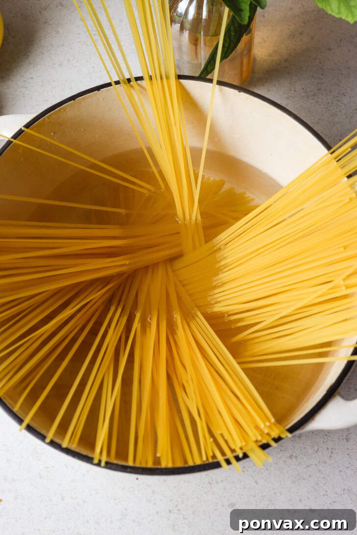 Cooked pasta, perfectly al dente, ready to be added to the caramelized cabbage mixture.