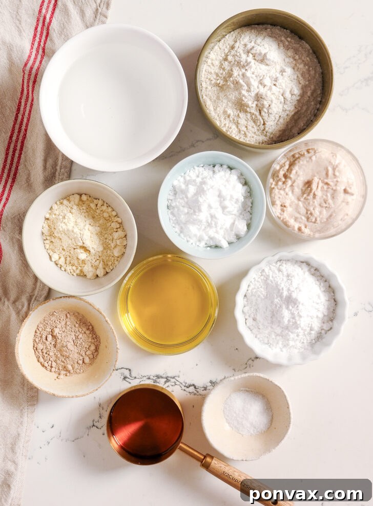 A stack of gluten-free sourdough flatbreads with a hand reaching for one.
