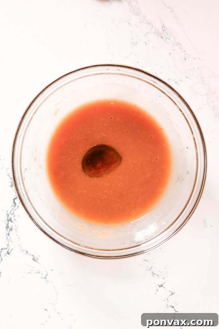 Step 1: Mixing warm water, maple syrup, and psyllium husk powder to form a gel.