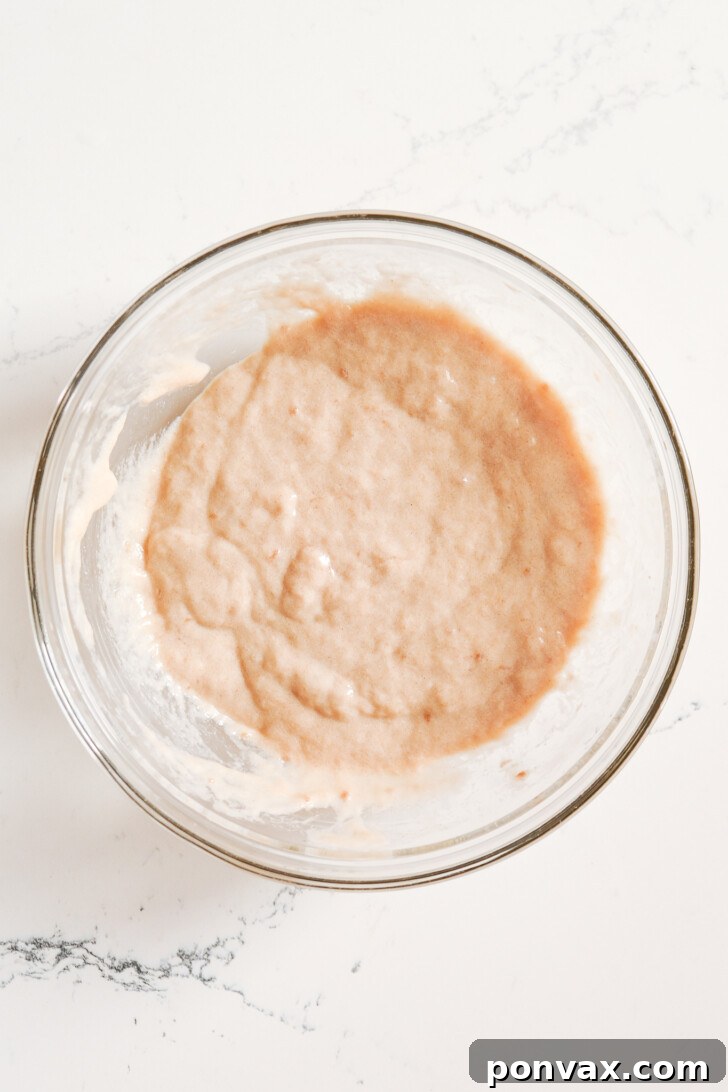 Step 1: Adding olive oil to the psyllium gel, preparing for sourdough starter.