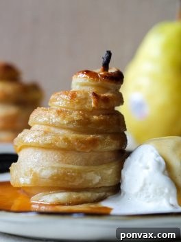 Apple Cider Poached Pears in Puff Pastry, a delectable and easy-to-make dessert.