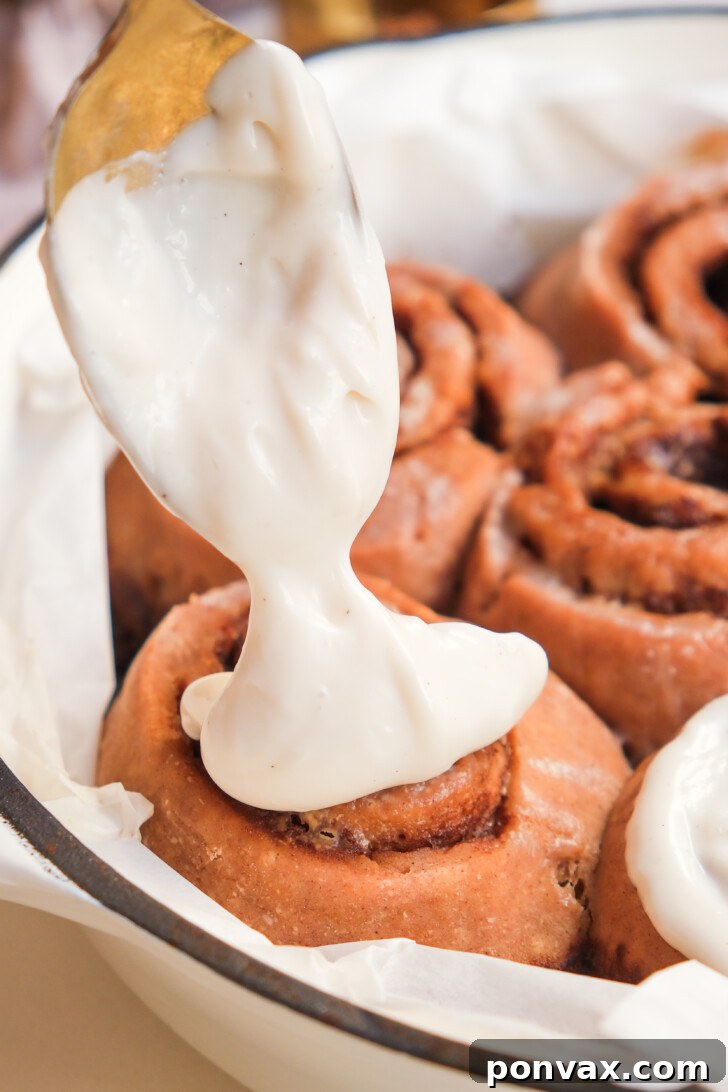 Irresistible Gluten-Free Sourdough Cinnamon Buns 18 Finished gluten-free sourdough cinnamon rolls with glaze, ready to eat.