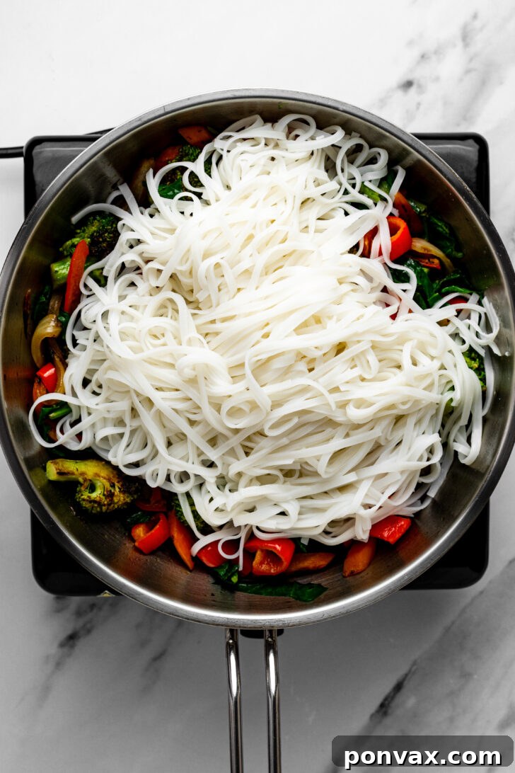 Zesty Lime Ponzu Noodle Stir-Fry 9 Step 4: Adding noodles and sauce