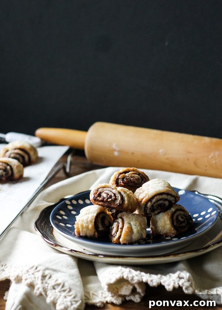 These flaky, melt-in-your-mouth Nutella Raspberry Rugelach are almost too easy to eat - they'll disappear before your eyes! They also keep incredibly well in the freezer.
