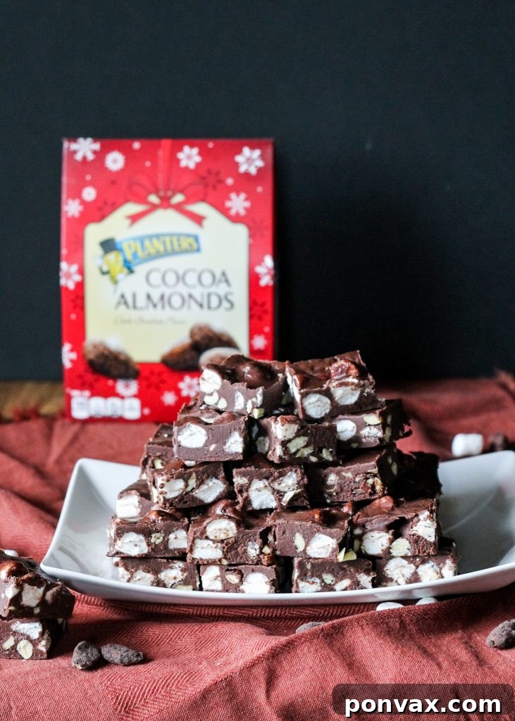 A close-up shot of a variety of holiday cookies and candies, ready to be packaged into festive gift boxes.
