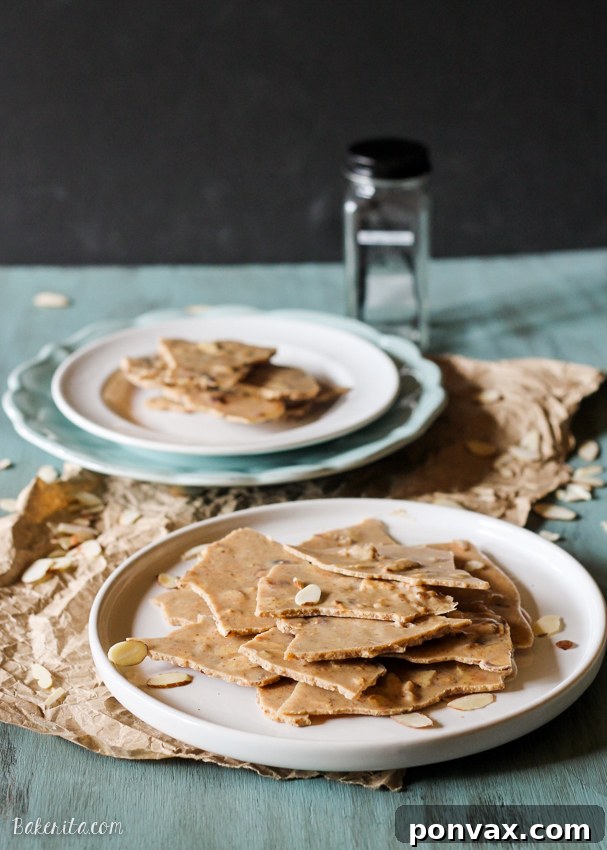 Crunchy and creamy Vanilla Almond Butter Bark, a 5-minute, 5-ingredient treat that's Paleo, sugar-free, vegan, keto, and gluten-free.