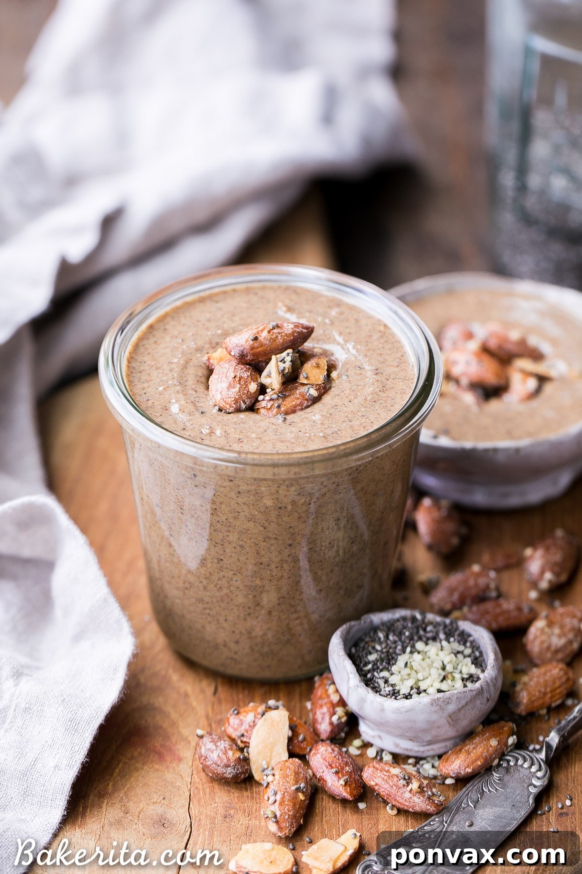Rich Maple Almond Butter swirled in a jar, showcasing its creamy texture.