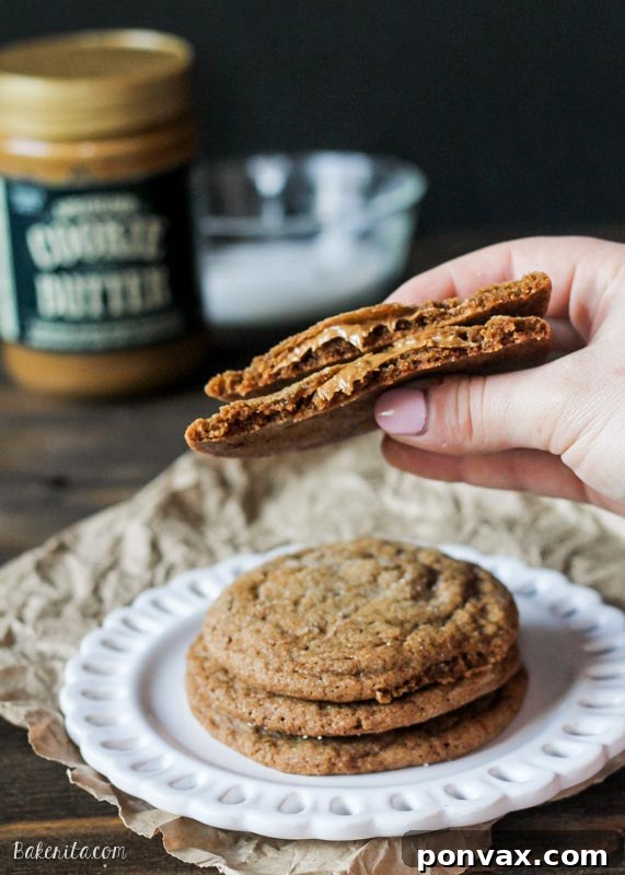 A vibrant second shot of the soft ginger cookies, emphasizing their distinct sugary coating and uniform, inviting appearance, hinting at the tender interior.