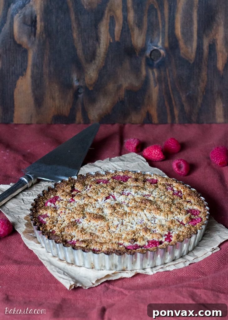 Paleo Gluten Free Vegan Raspberry Coconut Crumble Tart 2 This Raspberry Coconut Crumble Tart has an almond coconut crust that doubles as a crumble topping, filled with fresh raspberries! This easy recipe is Paleo-friendly, gluten free, refined sugar free, and vegan.