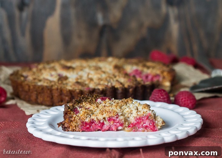 Paleo Gluten Free Vegan Raspberry Coconut Crumble Tart 3 This Raspberry Coconut Crumble Tart has an almond coconut crust that doubles as a crumble topping, filled with fresh raspberries! This easy recipe is Paleo-friendly, gluten free, refined sugar free, and vegan.