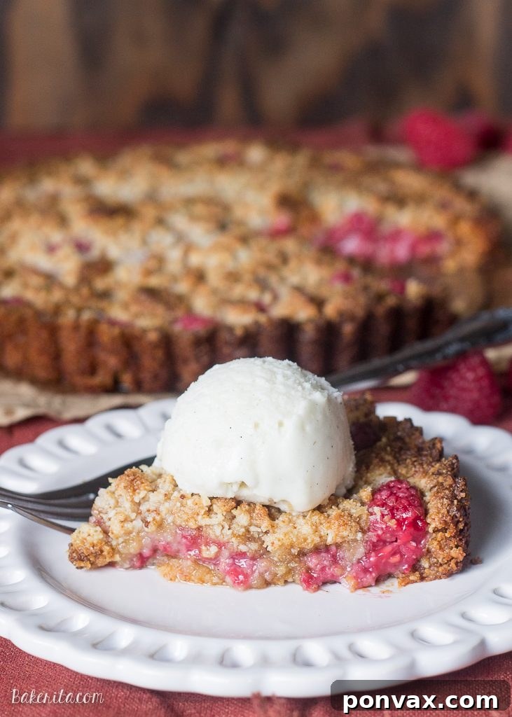 Paleo Gluten Free Vegan Raspberry Coconut Crumble Tart 5 This Raspberry Coconut Crumble Tart has an almond coconut crust that doubles as a crumble topping, filled with fresh raspberries! This easy recipe is Paleo-friendly, gluten free, refined sugar free, and vegan.